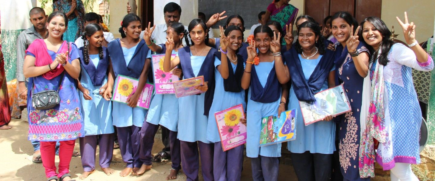 Vidhyadaanam volunteers with students at a school event